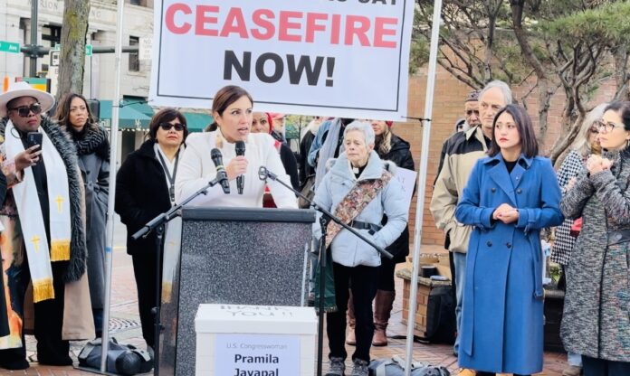 The photo: Councilmember Teresa Mosqueda giving a passionate speech during a rally for peace on November 15 in downtown Seattle. Also, State Senator Yasmin Trudeau and Council Member Tammy Morales can be seen in the photo far right hands folded. 